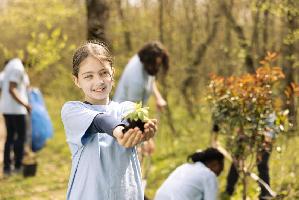 csm youngster advocating conservation forest ecosystems by holding seedling f4d3860065